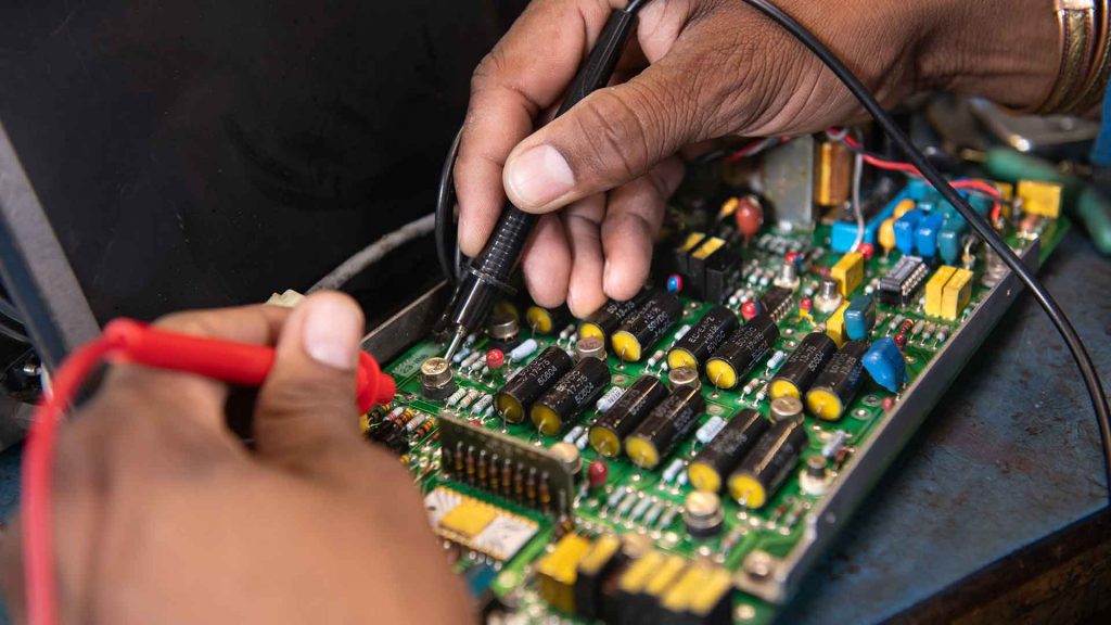 Purvis employee working on FSAS hardware