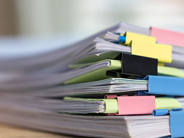 stack of papers on table